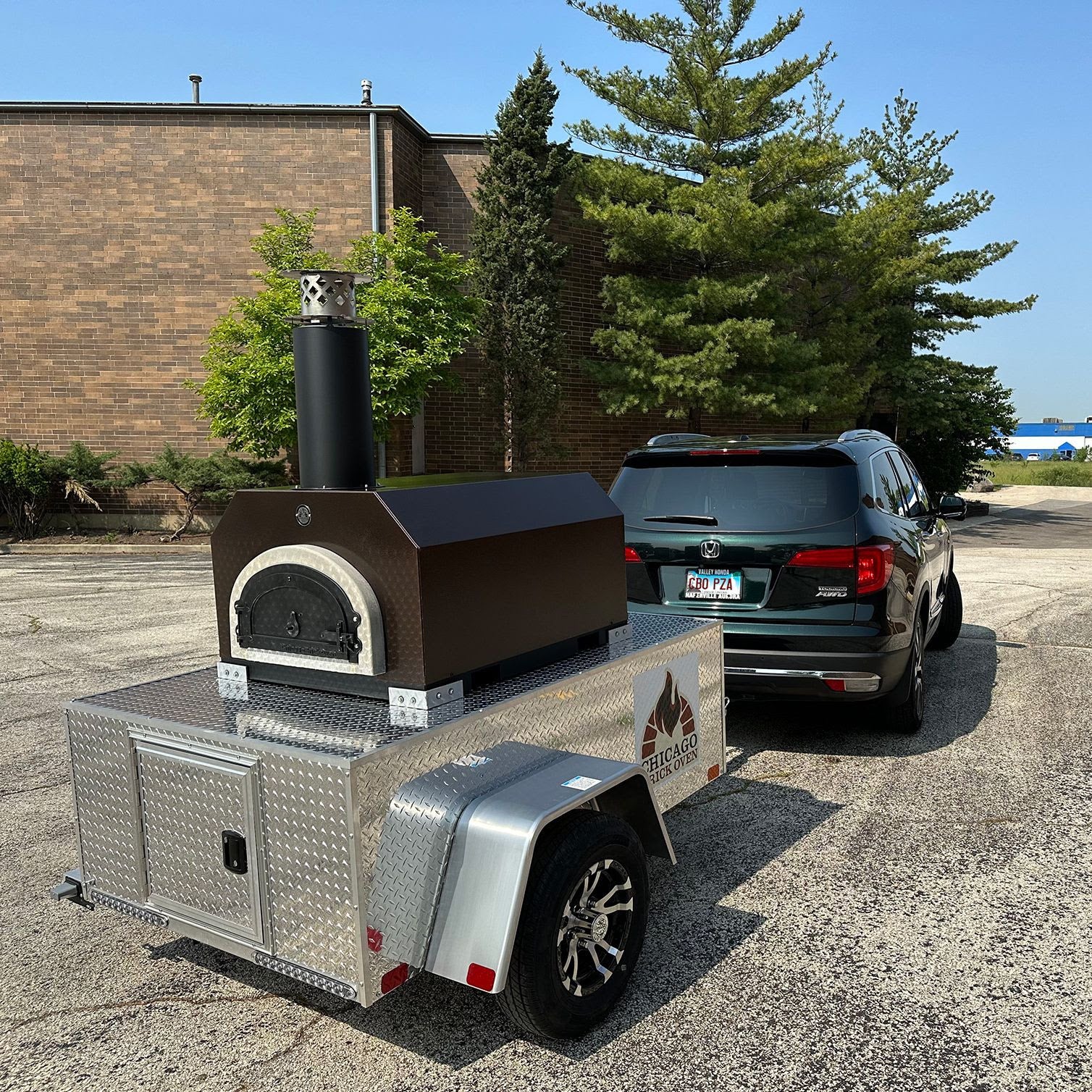 CBO Tailgater Pizza Oven with car