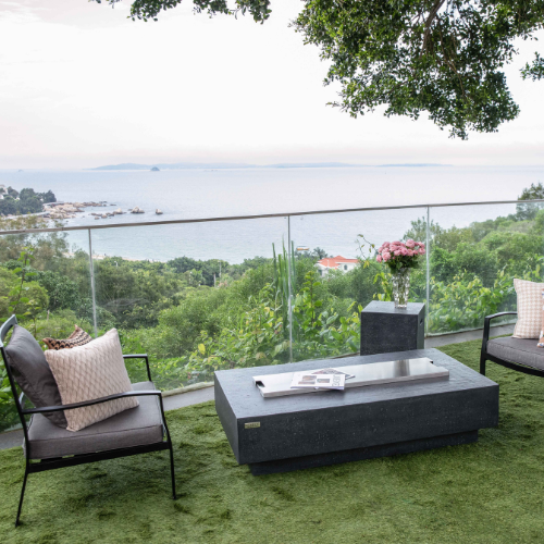 Elementi Hampton Fire Pit with Lid with sea in back