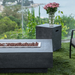 Elementi Hampton Fire Table with Lava Rock closeup and propane tank cover