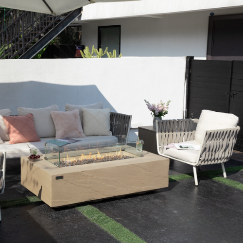 Elementi Plus Colorado Fire Table with Flame between sofa and couch