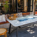 Elementi Plus Oslo Dining Fire Table with windscreen And blue fire glass