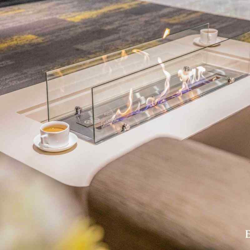 Elementi Sydney ethanol fire Pit Cream white with flame and windscreen