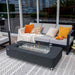 Elementi Sydney Ethanol Fire Pit Slate black with windscreen near couch