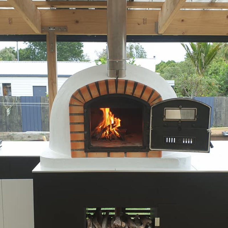 Authentic Lisboa Premium Pizza Oven built into a custom outdoor kitchen setup, blending traditional design with modern outdoor living