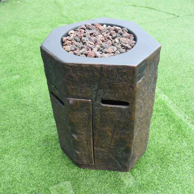 Modeno Basalt Column Fire Pit Angle with lava rock on the grass