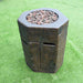 Modeno Basalt Column Fire Pit Angle with lava rock on the grass