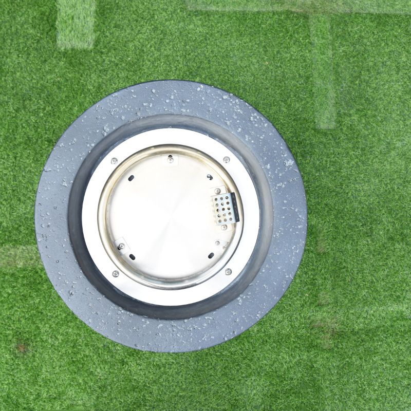 Modeno Lava Tube Fire Pit Burner top view backyard lawn grass