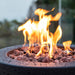 Modeno Lava Tube Fire Pit Close look of the lava rocks and flame