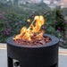 Modeno Lava Tube Fire Pit with lava rocks and flame
