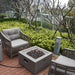 Modeno Ridgefield Fire Pit with flame near couch Backyard lifestyle
