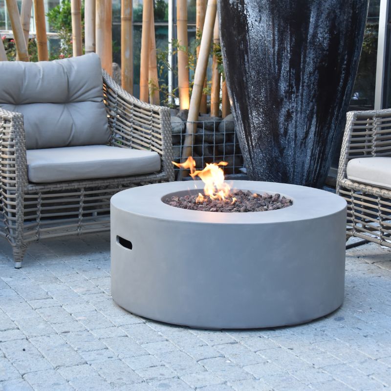 Modeno Tramore Fire Table with flame and couch outdoor