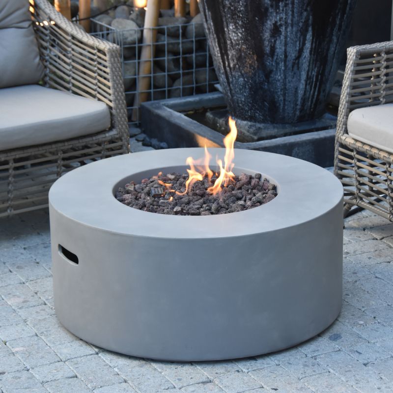 Modeno Tramore Fire Table with Flame set Up near couch