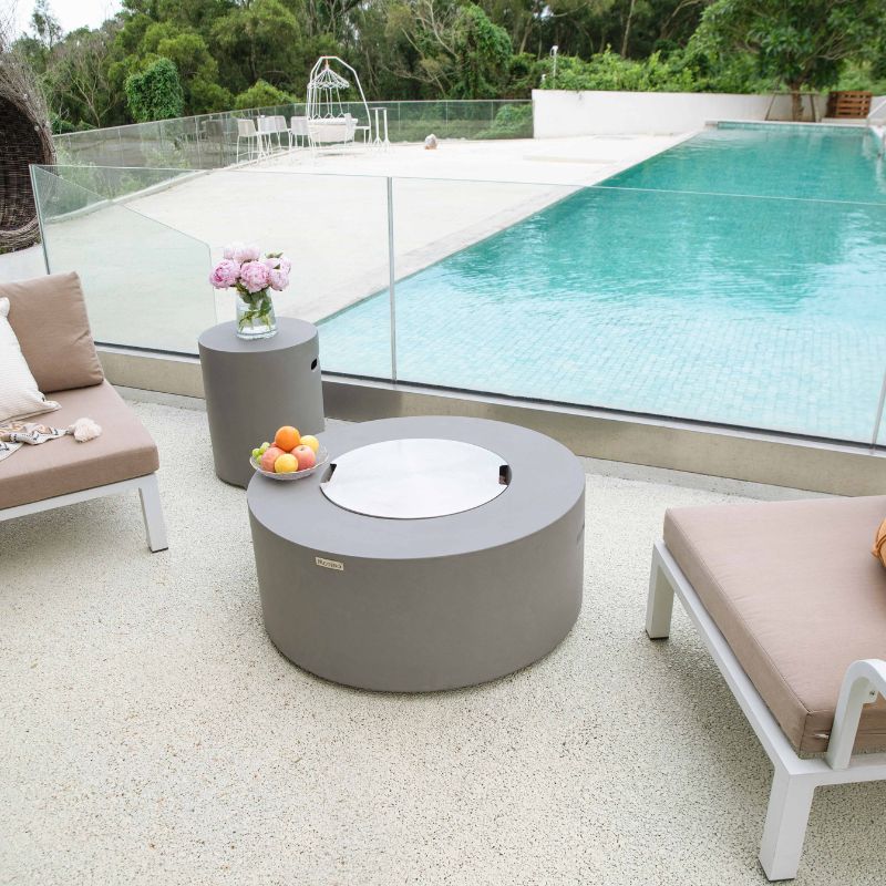 Modeno Tramore Fire Table With Lid near couch and pool