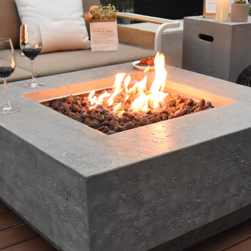 Manhattan Fire Table with Flames of sofas around and wine closeup