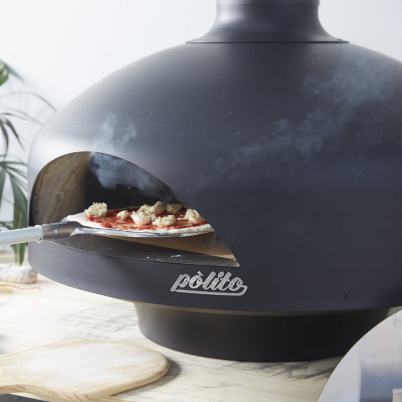 Polito_Giotto_pizza_oven_Black_Pizza_going_in_on_pizza_peel