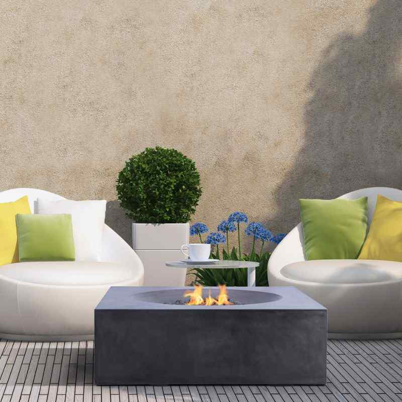 Pyromania Tao Fire Table Charcoal with flame and near the couch Outdoor Heating