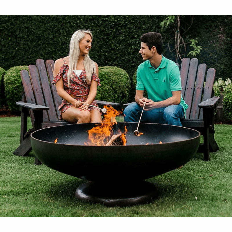 SeasonsFirePitsVulcanSteelFirePitwithcouple-min